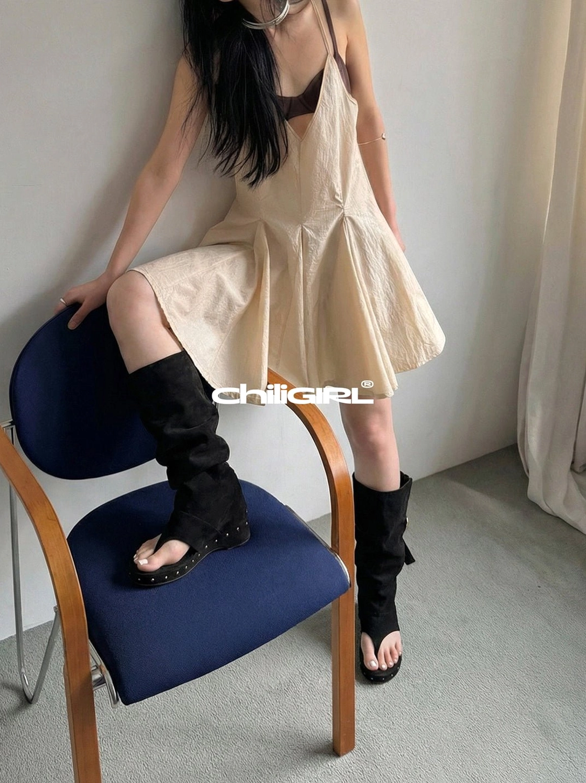 Black rivet thong low-wedge mid-calf sandal boots Y2K streetwear footwear detail view