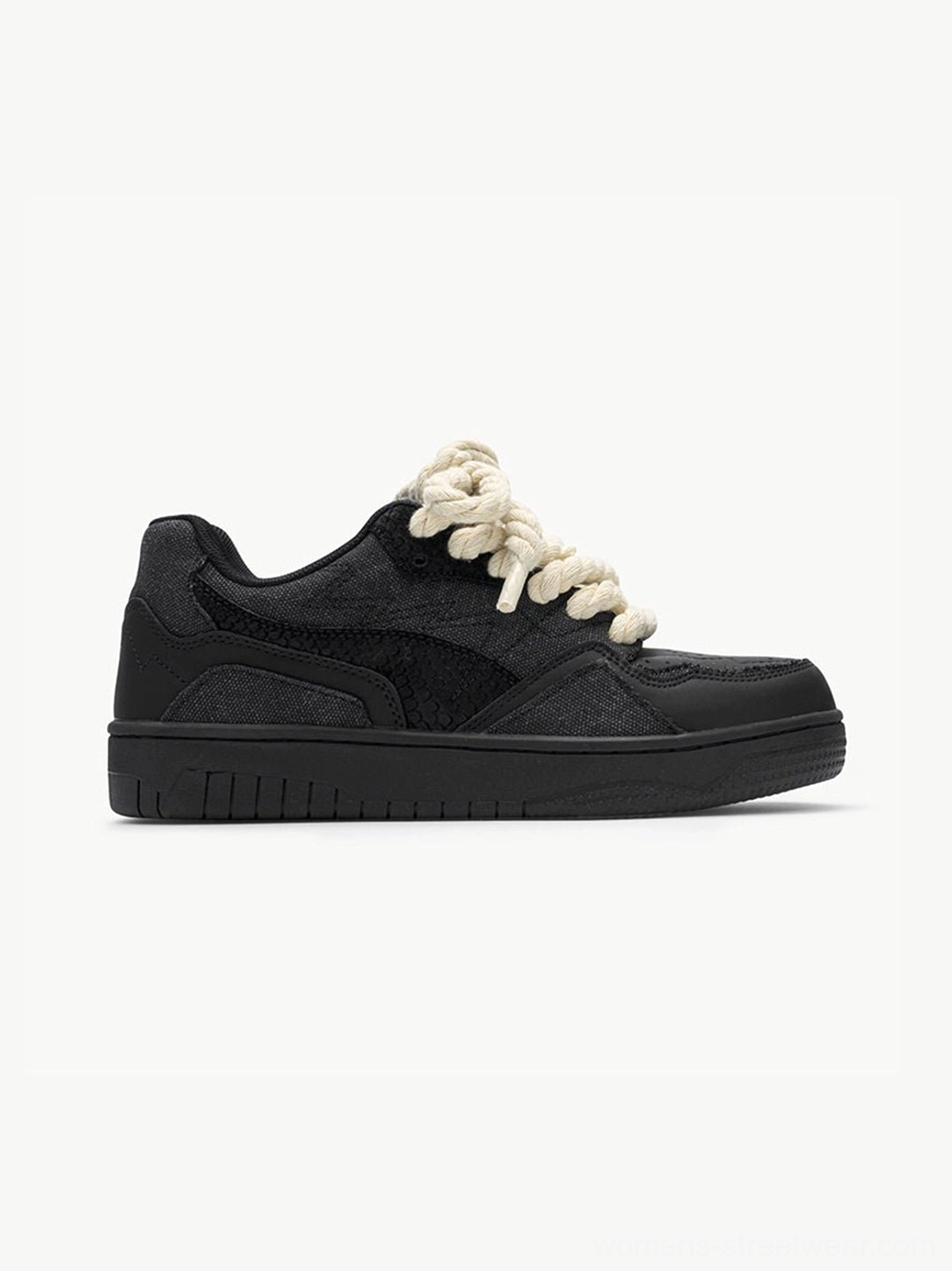Alternative side profile of black rope lace low-top streetwear sneakers with skate-inspired silhouette