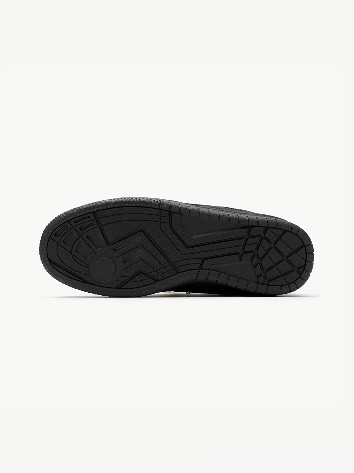 Patterned black rubber outsole of black rope lace low-top streetwear sneakers