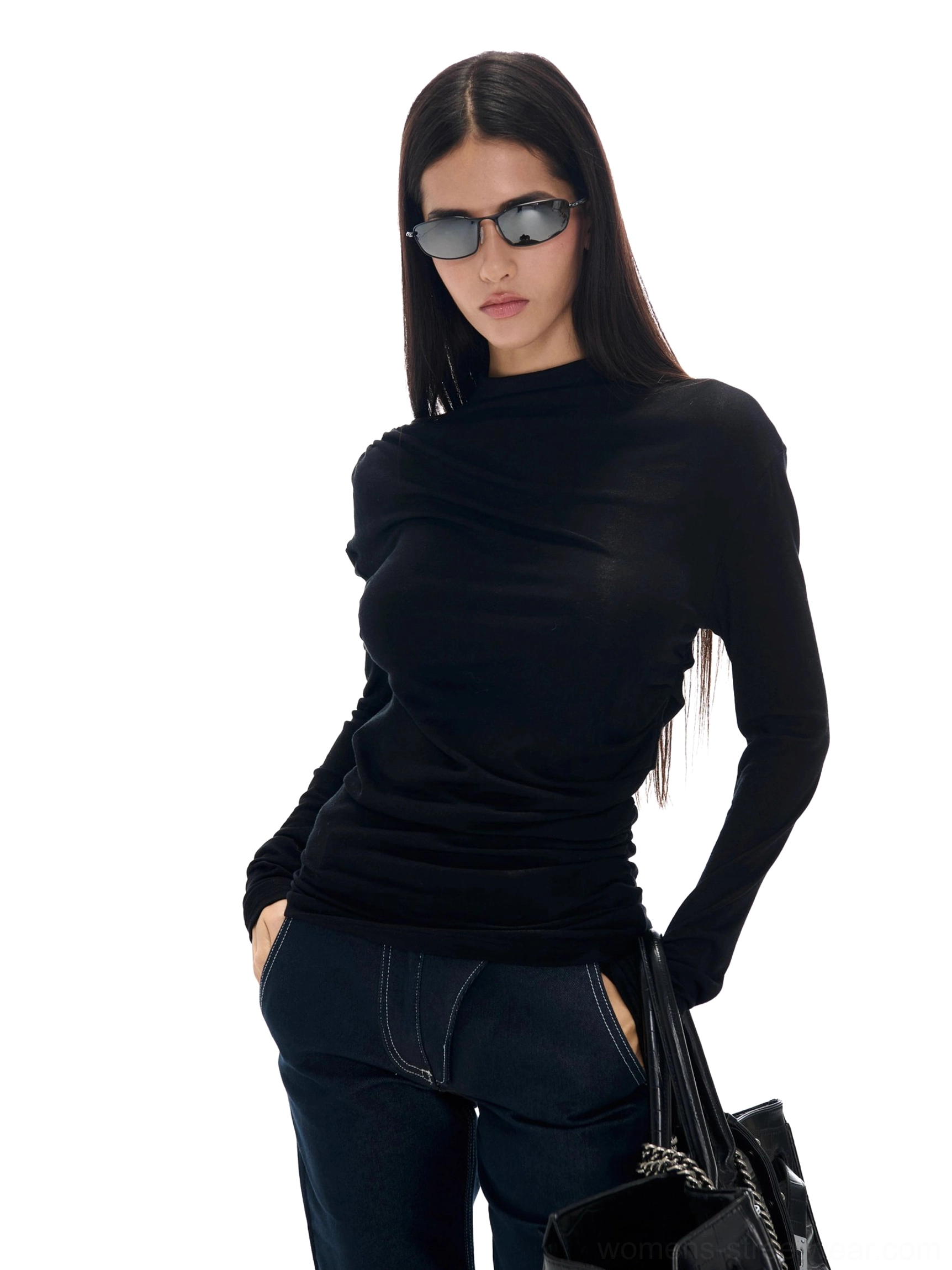 Black ruched mock neck Tencel wool knit long sleeve top in a slim fitted streetwear outfit with wide-leg jeans