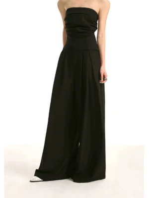 Black strapless ruched tube top and flowing wide-leg trousers back view in minimalist streetwear styling