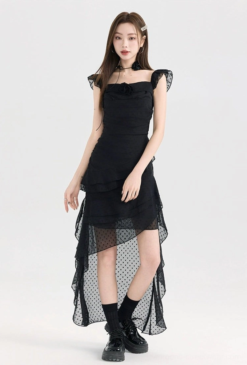 Black ruffle high-low polka dot dress with square neckline, ruffle shoulder straps, sheer dotted tulle asymmetrical hem, and fitted bodice