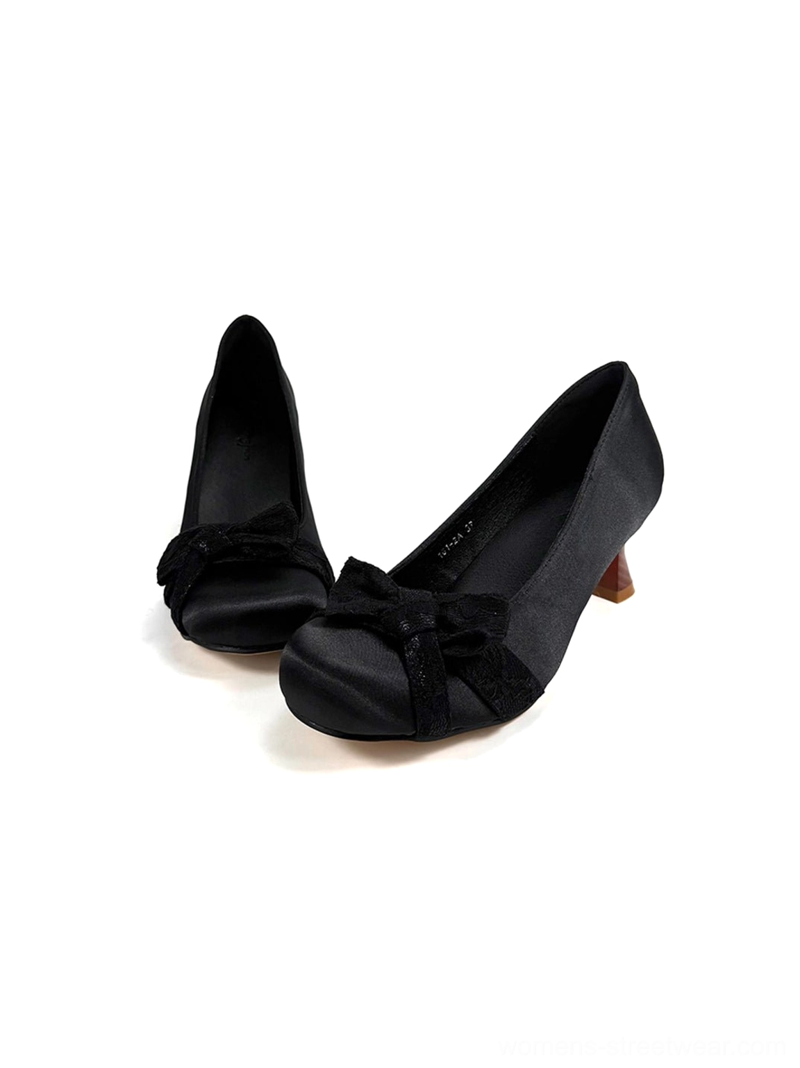 Front view of a pair of black satin bow pumps with rounded toe caps and matching gathered vamp decorations