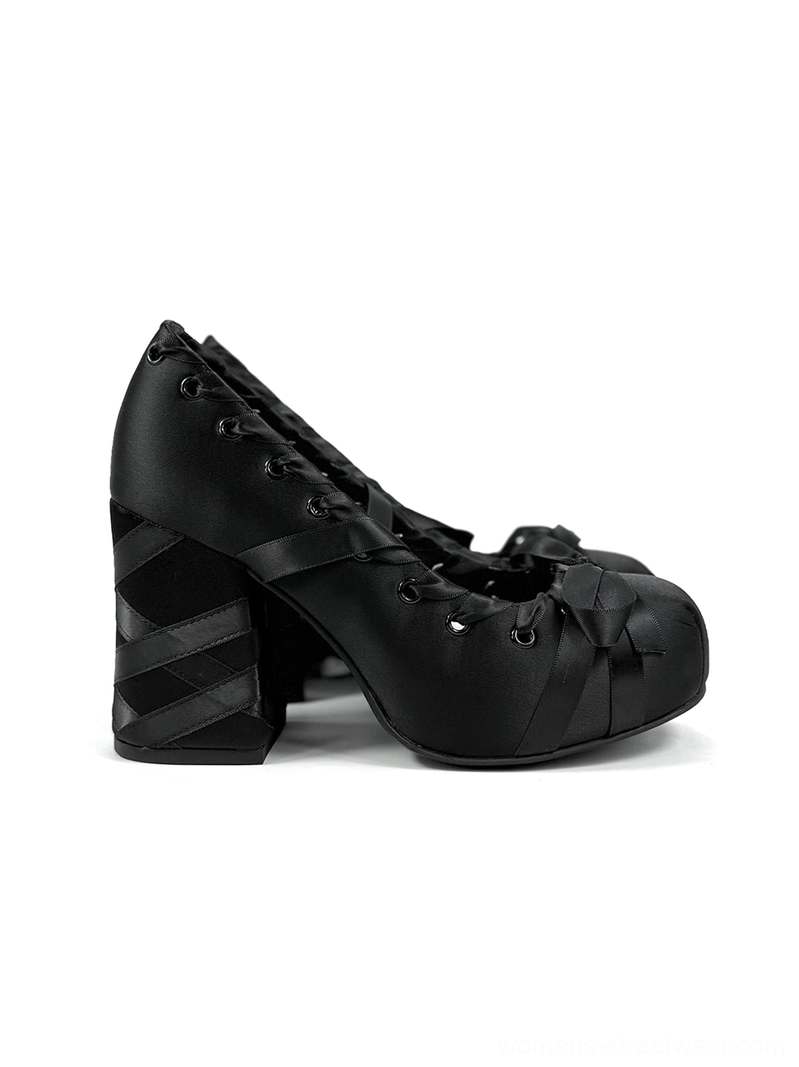 Side profile of black satin lace-up platform pumps with bow toe cap, closed round toe, striped chunky heel, and gothic ballet design