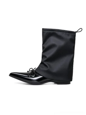 Black satin slouch pointed-toe mid-calf streetwear boots with glossy toe cap and small bow side product view