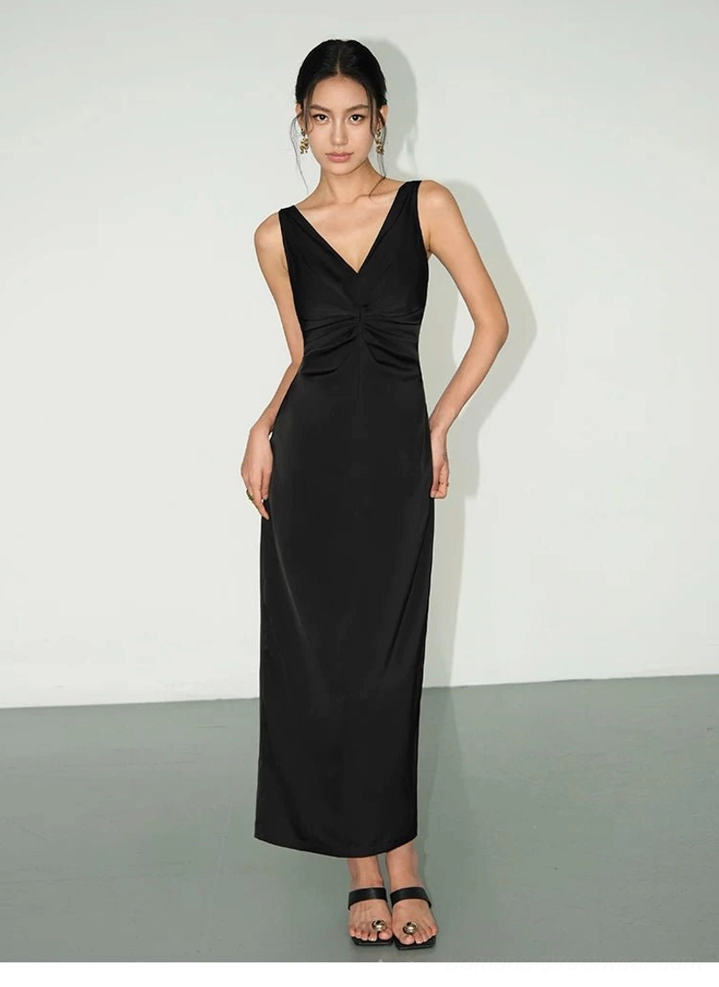 Black satin twist-front maxi slip dress in a full-body front view featuring deep V-neck, gathered bust detail, slim floor-length fit and strappy heels