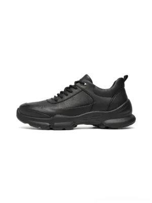 Black sculpted-sole chunky sneakers with pebbled leather-look upper shown in front lateral product view on white background