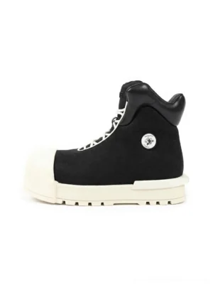 Black sculpted-toe platform high-top boots shown from the left side with oversized off-white toe cap, thick sole, high padded collar, lace-up front, and round metal side detail