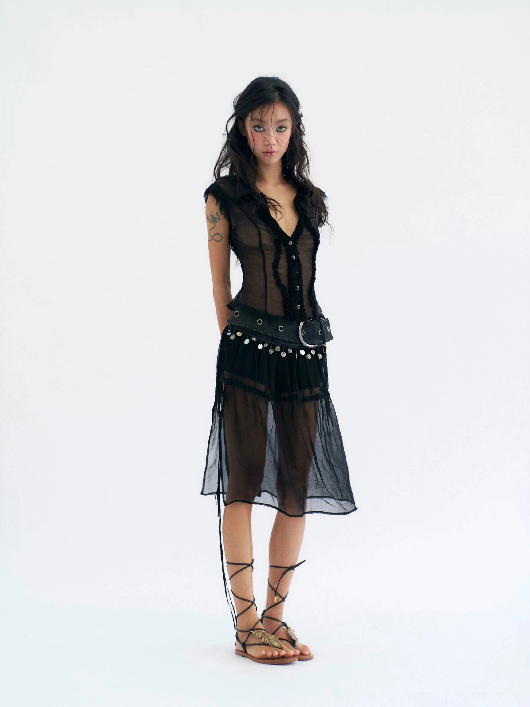 Black sheer coin trim midi skirt rear side view showing low rise waist and lightweight overlay
