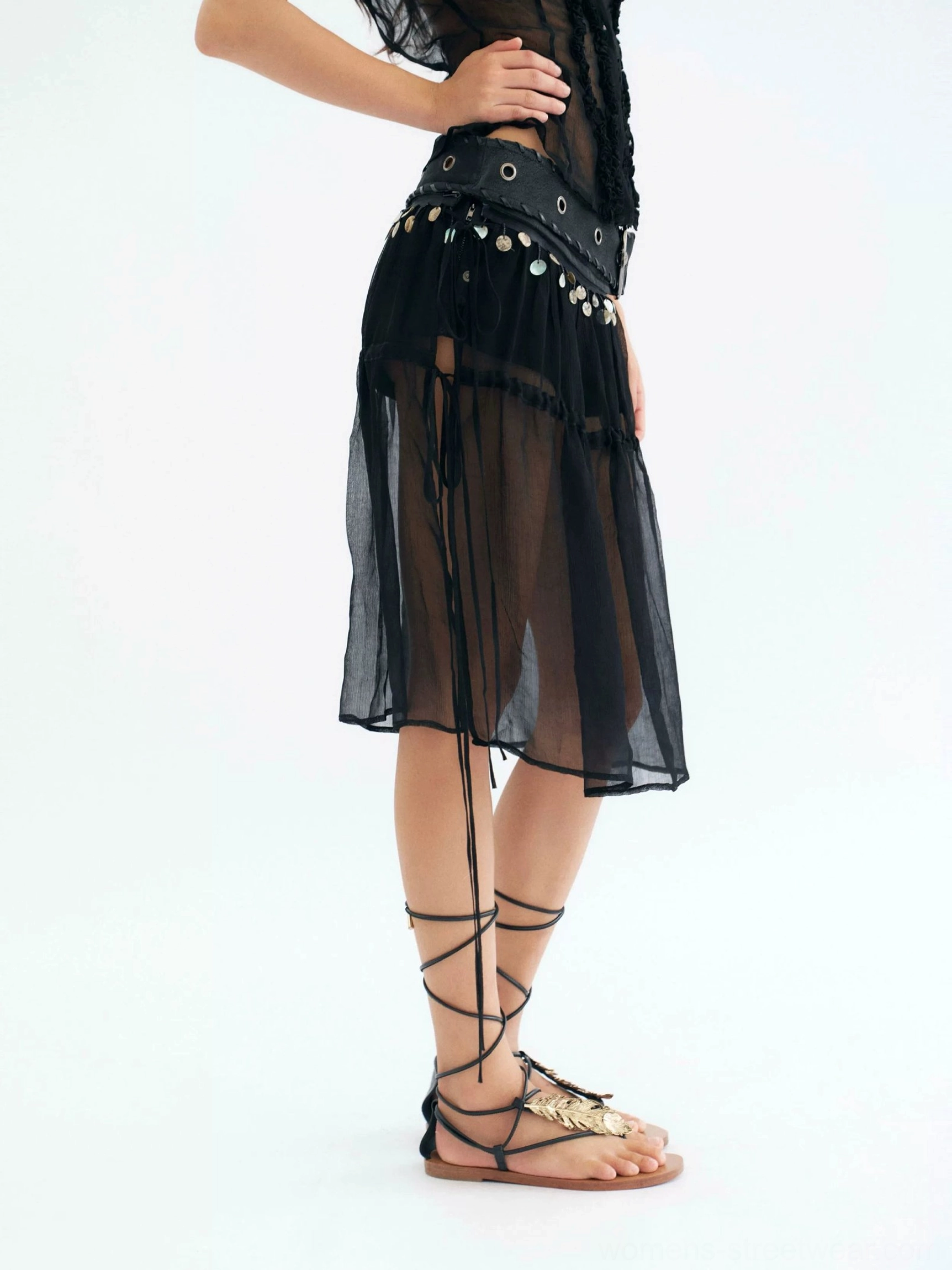 Black sheer coin belt midi skirt with built-in cotton shorts shown from the rear three-quarter view