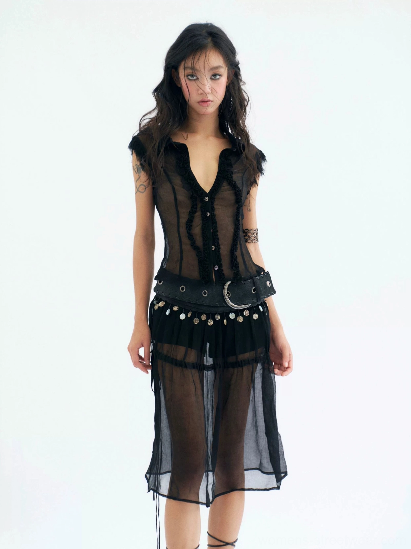 Black sheer coin belt midi skirt with cotton shorts styled with a cropped sheer top front view