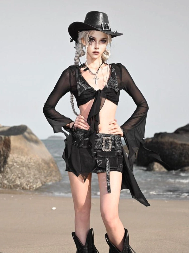 Black sheer flare sleeve cardigan styled with a cropped top and asymmetrical distressed denim mini shorts for festival fashion