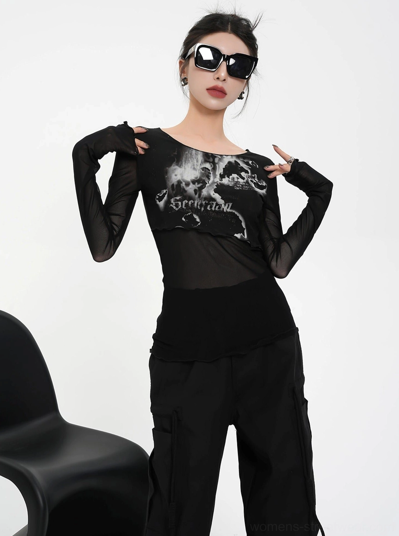 Black sheer mesh romantic floral graphic cropped long sleeve top styled with black cargo pants