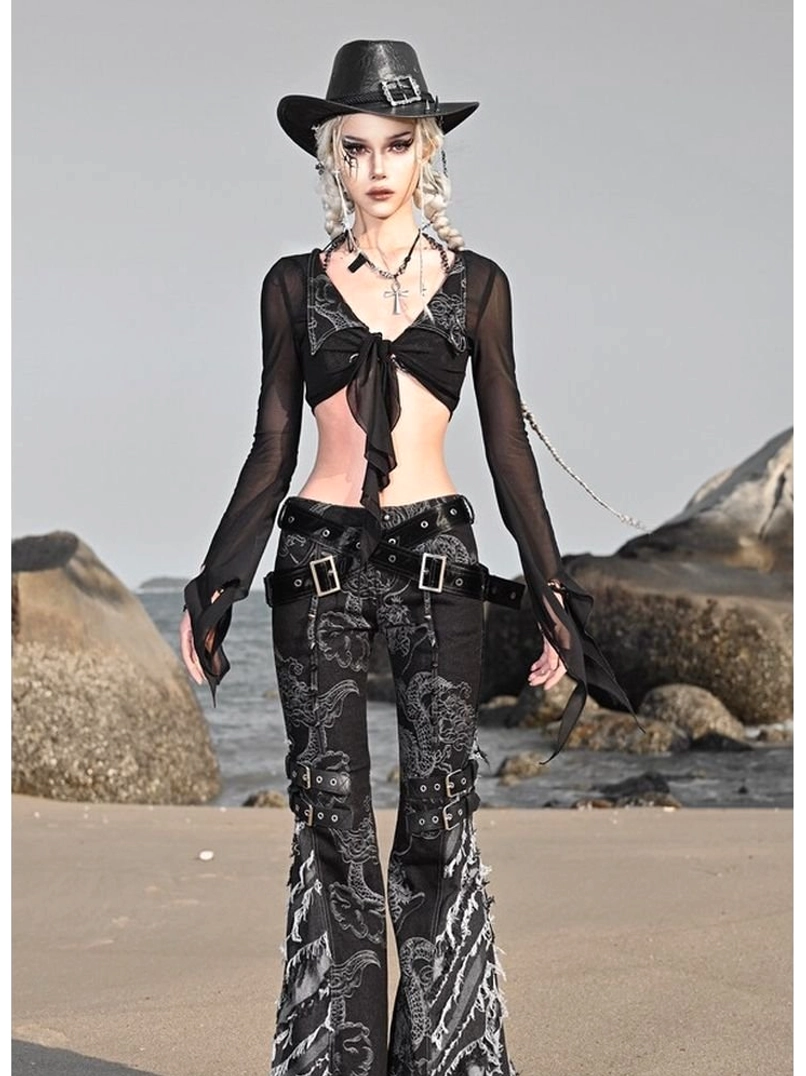 Black sheer mesh short cardigan layered over a cropped top with high-waisted paisley flare pants and western belt details