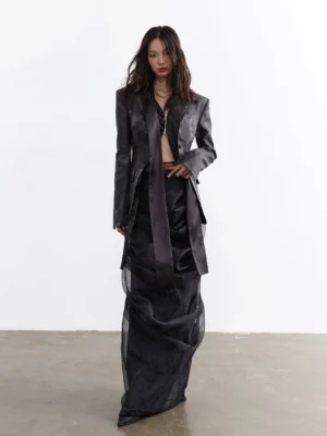Front view of black sheer overlay two-piece maxi skirt set with solid underskirt and floor-length layered silhouette