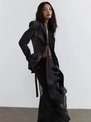 Black sheer overlay two-piece maxi skirt set styled with a distressed blazer in a three-quarter studio view