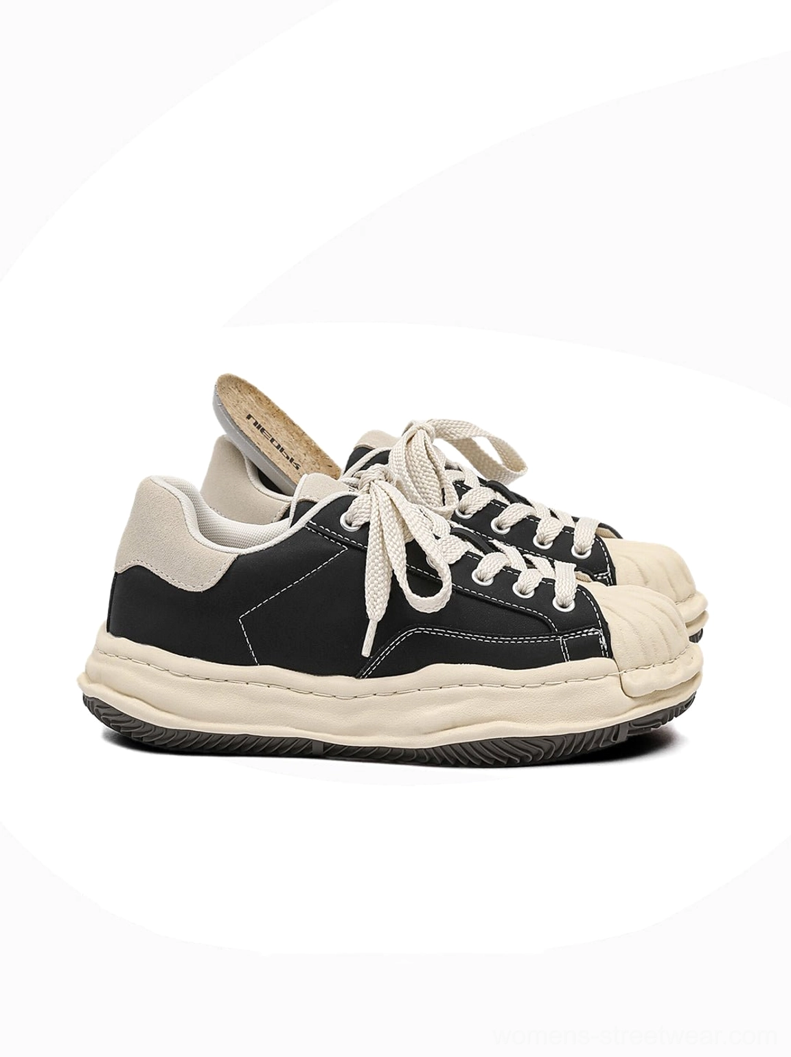 Black shell-toe platform sneakers displayed as a versatile everyday footwear option for Korean fashion and casual urban outfits