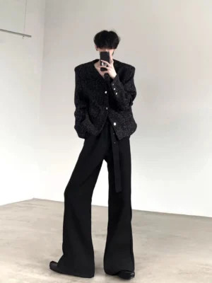 Black shimmer collarless cropped blazer jacket front view styled with high waisted wide leg trousers