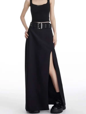 Black side-slit maxi skirt with wide grommet belt and silver buckle styled with cropped tank top and platform boots