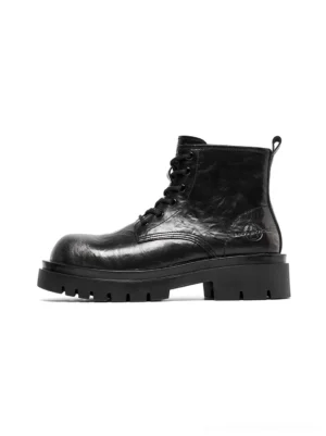 Black side-zip lace-up combat boots with distressed synthetic leather upper and chunky lug platform sole shown in left side view