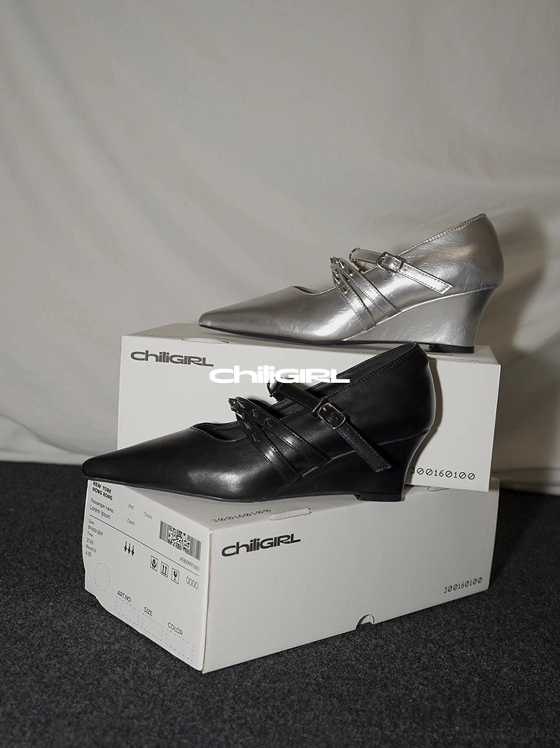 Black and silver wedge pumps with matching pointed toes dual buckle straps and low wedge heels