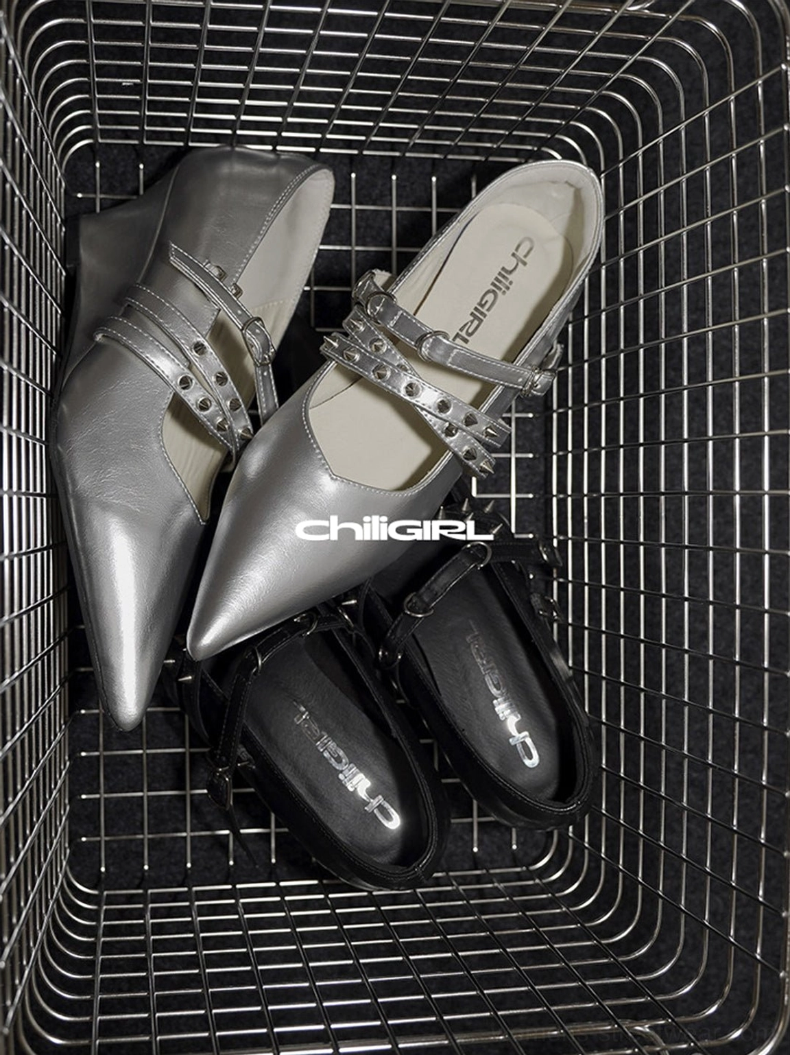 Black and silver pointed toe strap wedge pumps stored together showing dual buckle details and modern footwear styling