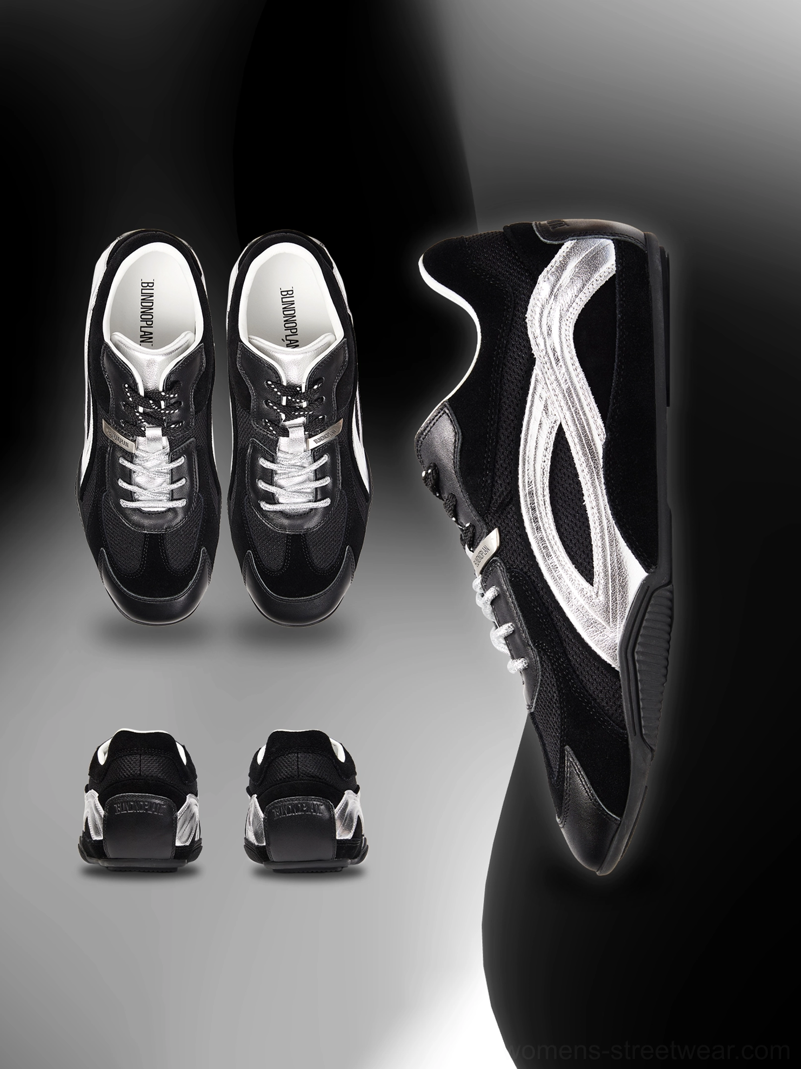 Black and silver low-profile racing sneakers with suede contrast panels, metallic side stripes, lace-up front, and slim rubber sole studio product view
