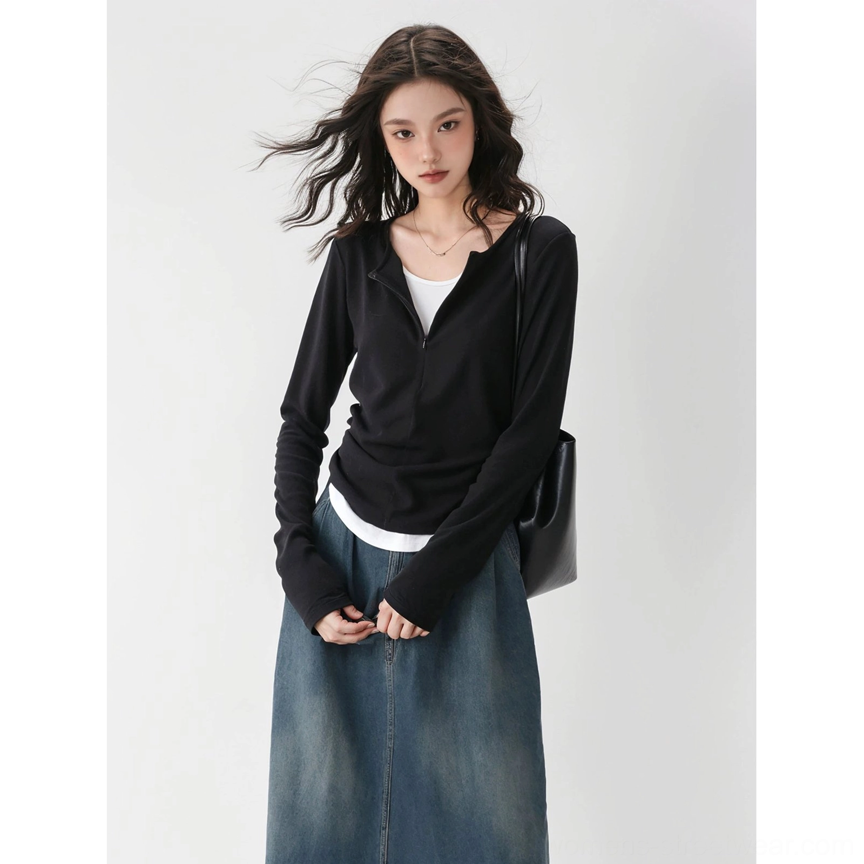 Black slim ribbed knit half-zip base layer top with fitted silhouette and layered two-piece streetwear styling