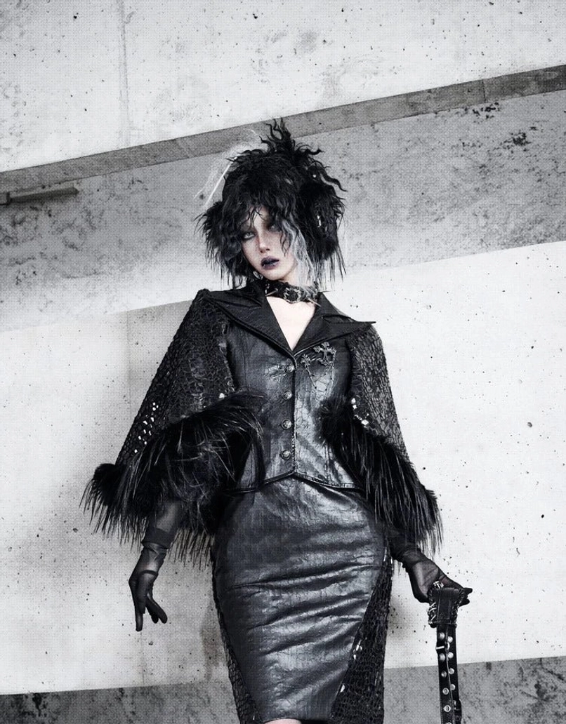Black gothic snakeskin mesh pencil skirt paired with a structured corset top and matching dark statement outerwear