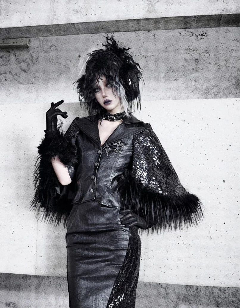 Front view of gothic black snakeskin mesh faux fur pencil skirt styled with a matching cape jacket in a dark streetwear outfit