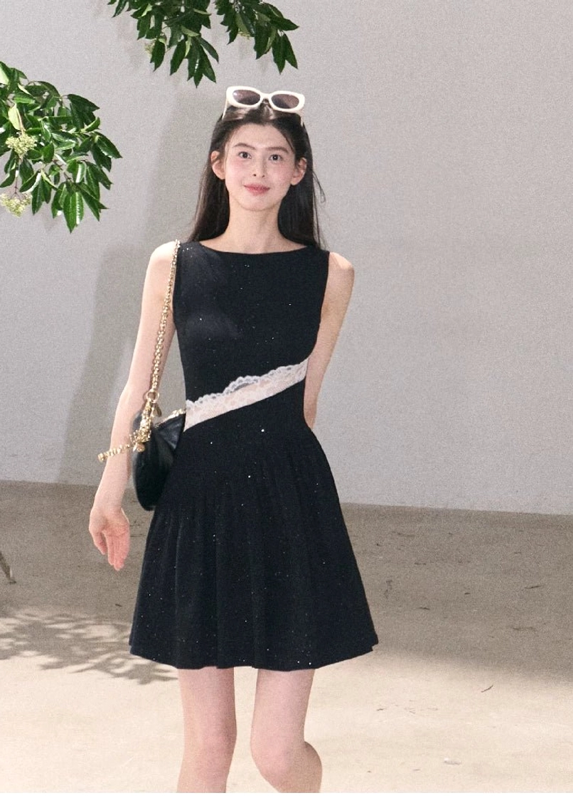 Black sparkly asymmetrical lace waist mini dress with sleeveless boat neckline white lace panel and flared hem