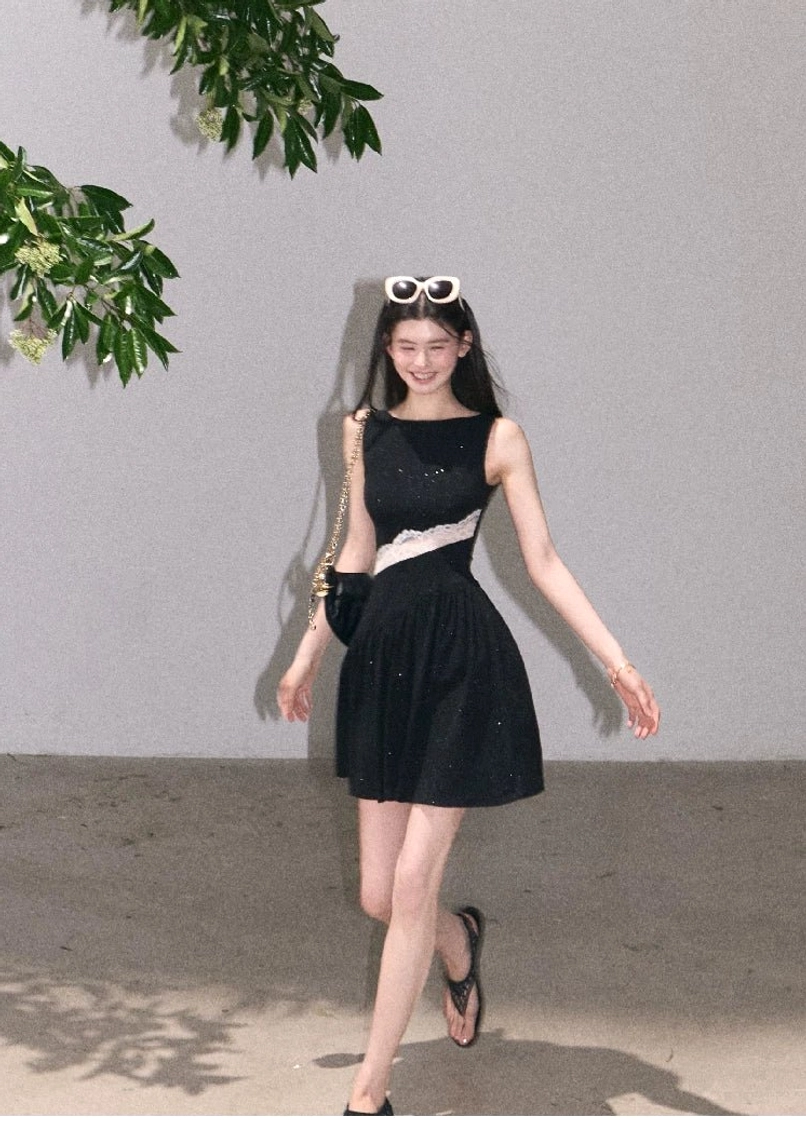 Black sparkly sleeveless asymmetrical lace waist mini dress with flared skirt and open toe sandals