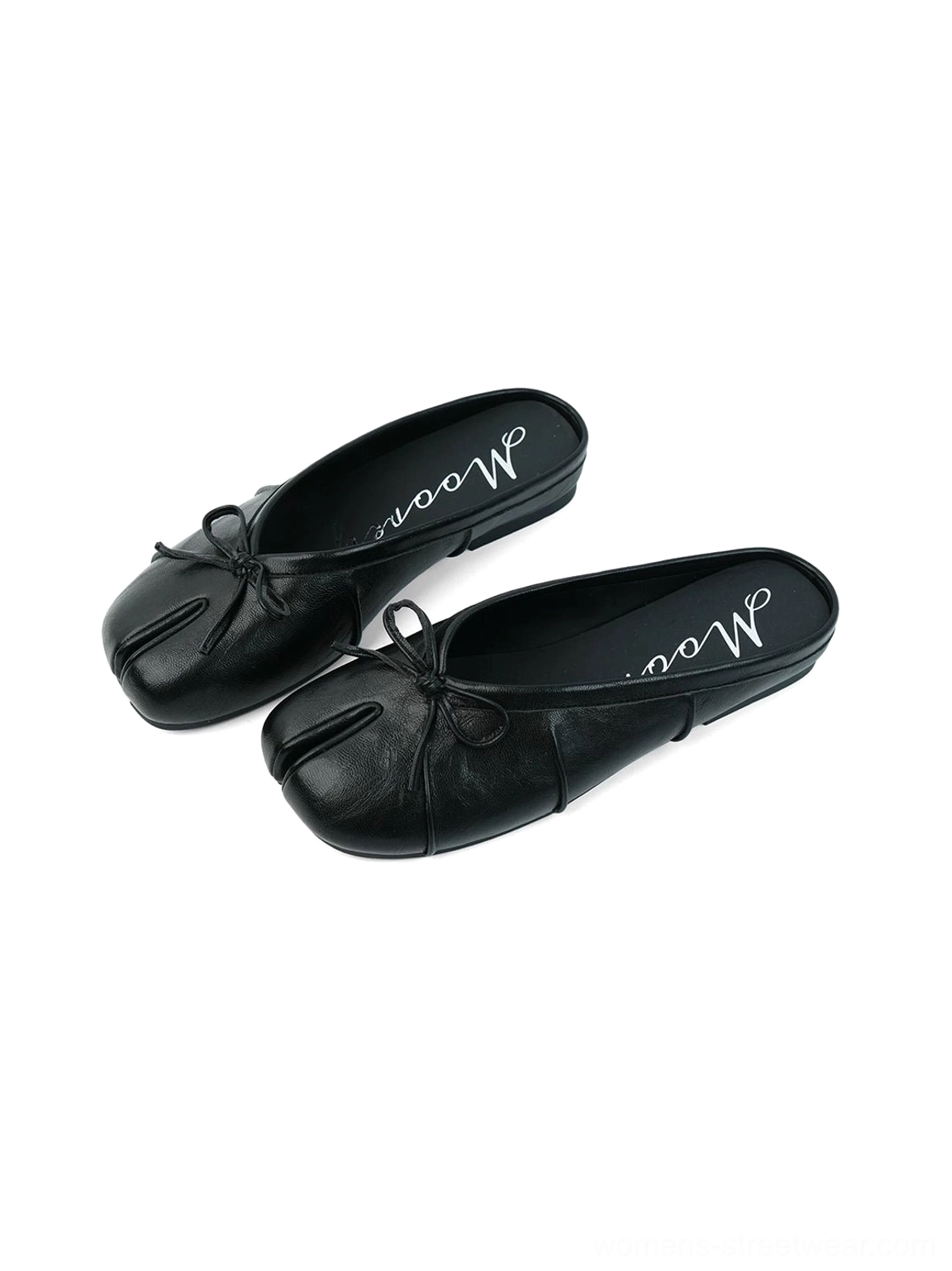 Side view of black split tabi toe bow mules highlighting the smooth upper and low-profile rubber outsole