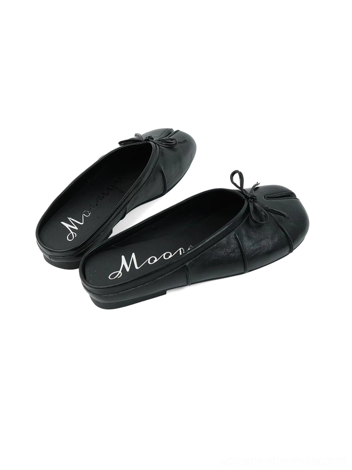 Black split toe bow strap mules shown from above with open heel, branded insole, and flat rubber sole