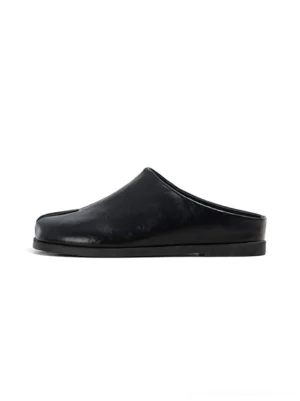 Black split-toe leather backless flat mules shown from the side on a white background