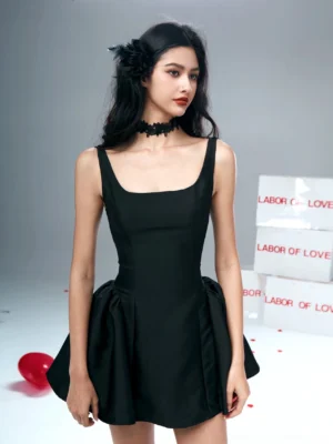 Black square neck fit-and-flare mini dress worn by model in studio front full body view