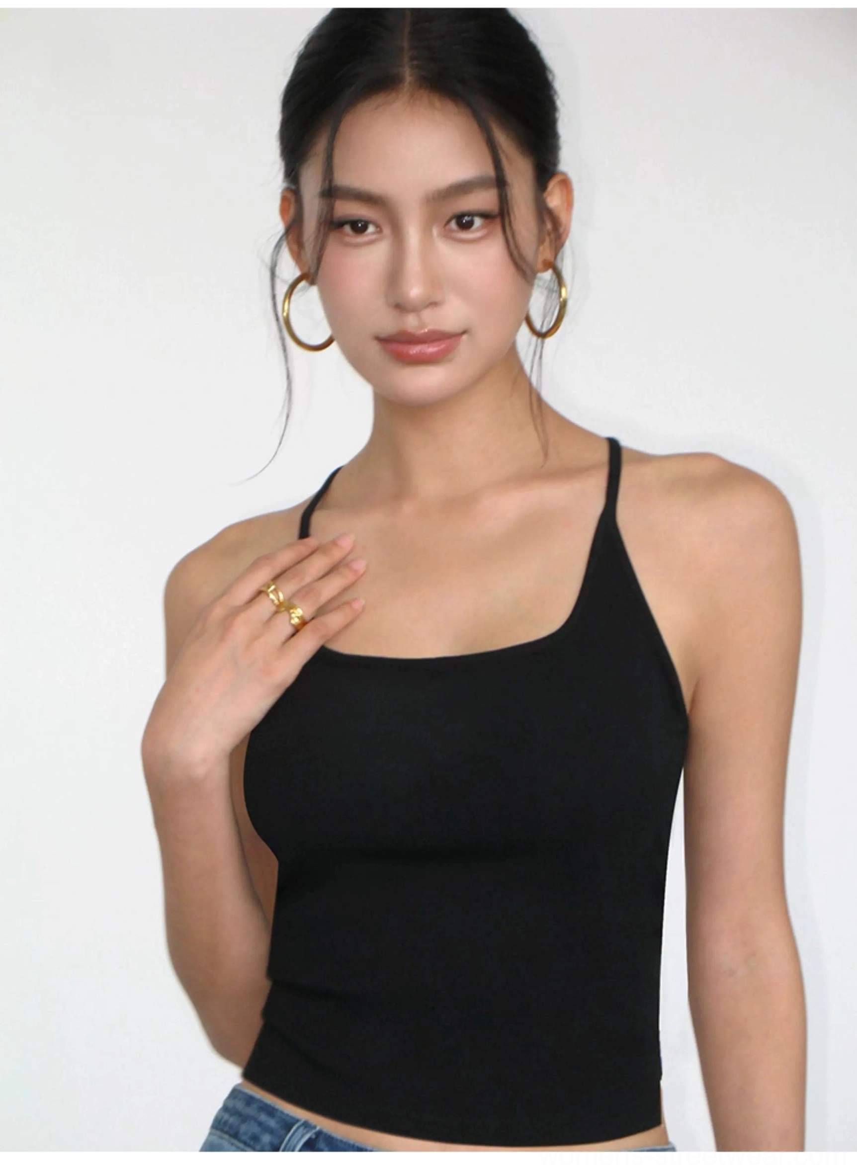 Close-up of black square neck fitted knit crop tank with delicate spaghetti straps