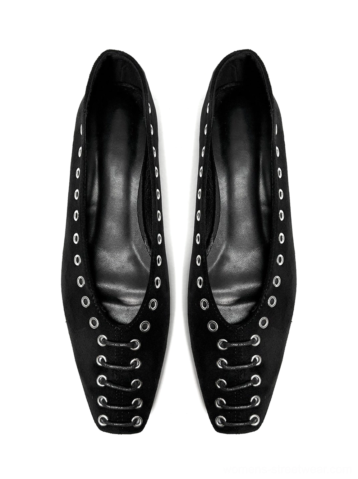Top-down flat lay of black square-toe ballet flats with front eyelet lace-up inspired detailing