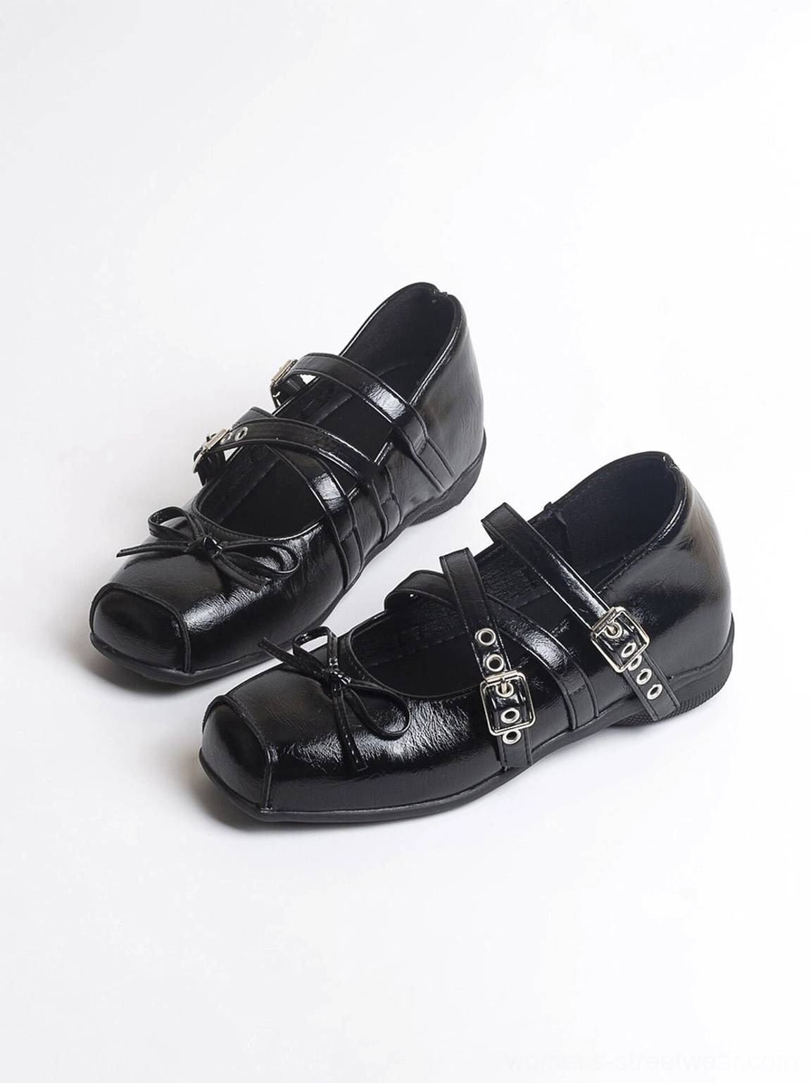 Black square-toe leather Mary Jane flats displayed in a three-quarter product view with double buckled straps