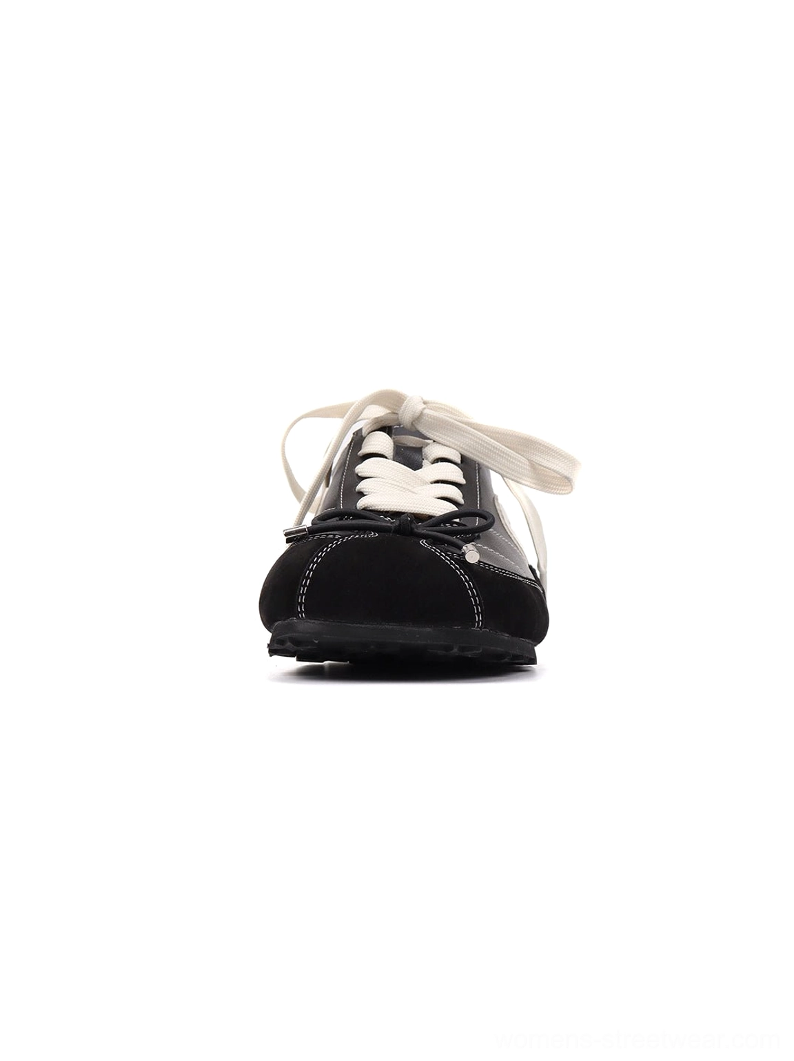 Close-up front view of a black square-toe sport ballet flat with white laces, stitched toe cap, and low-profile sole