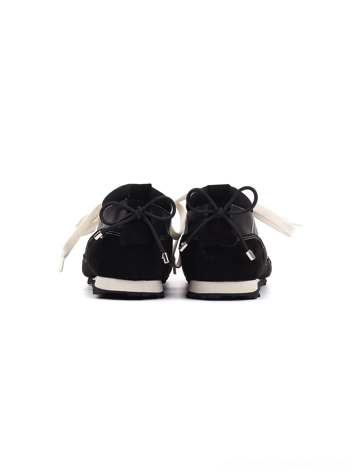 Rear view of black square-toe sport ballet flats with heel tie details, matching stitching, and white rubber sole edges