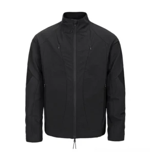 Black techwear stand-collar softshell jacket shown from the front with multiple zippered pockets, geometric panel stitching, reinforced elbow details, and adjustable hem