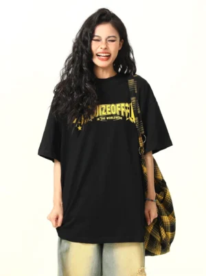 Black star graphic oversized streetwear t-shirt front view styled with wide-leg jeans