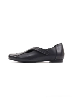 Black star panel leather ballet flats with square toe shown in side profile on a white background