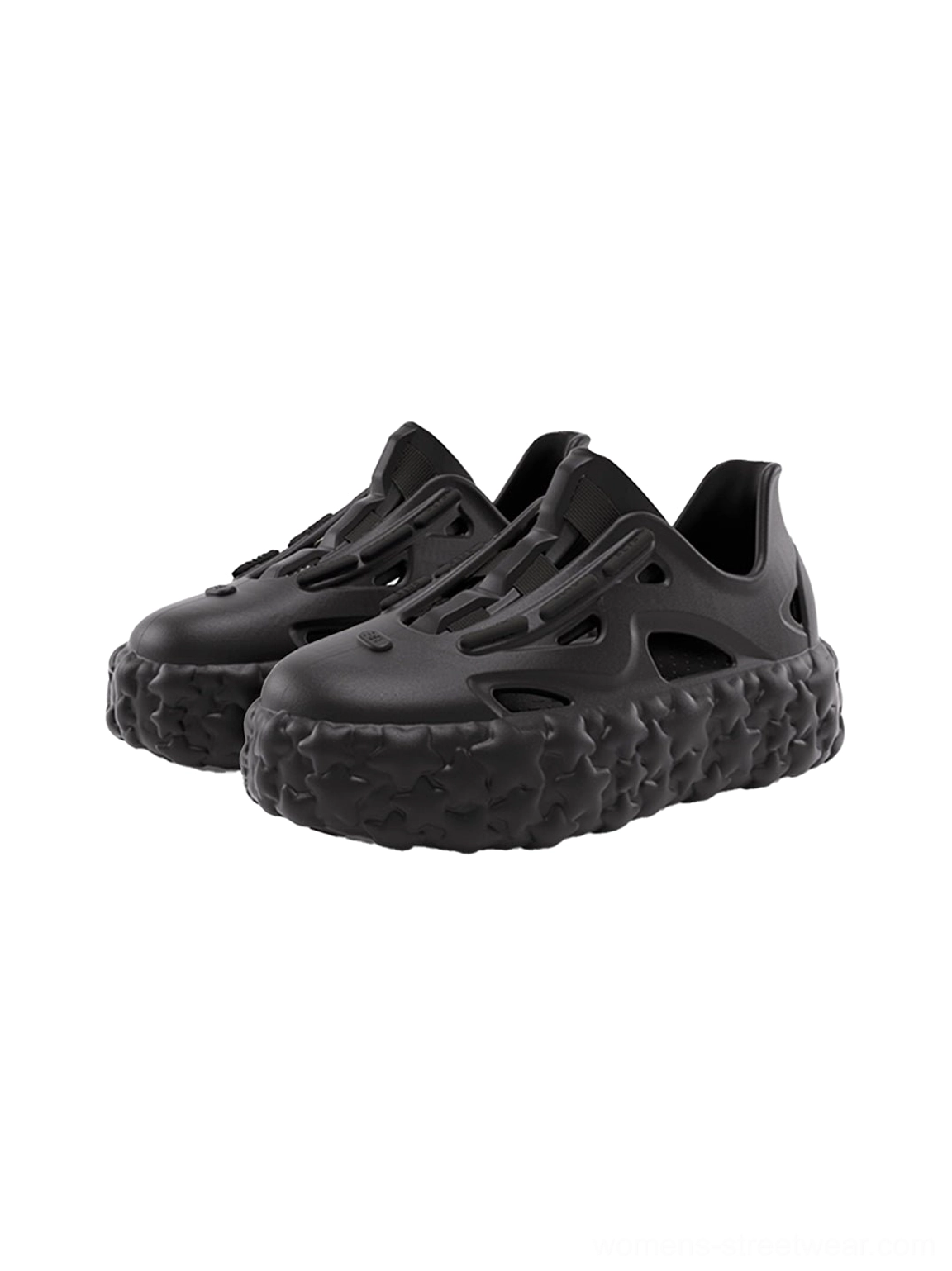 Black star platform sandals shown in a front three-quarter view with ventilated upper chunky sole and easy slip-on design