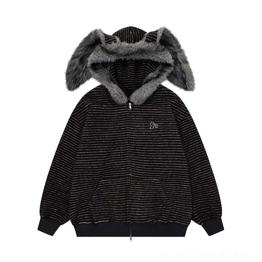Flat lay display of an all-black striped bunny-ear hoodie with light gray horizontal stripes, dark faux-fur hood trim, and ribbed cuffs