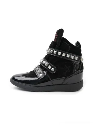 Black studded cowhide wedge high-top shoes with patent toe cap, silver rivet straps, hidden platform wedge, and star embroidery shown from the side