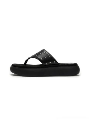 Black leather platform thong sandals with silver-tone rivets shown from above on a clean background