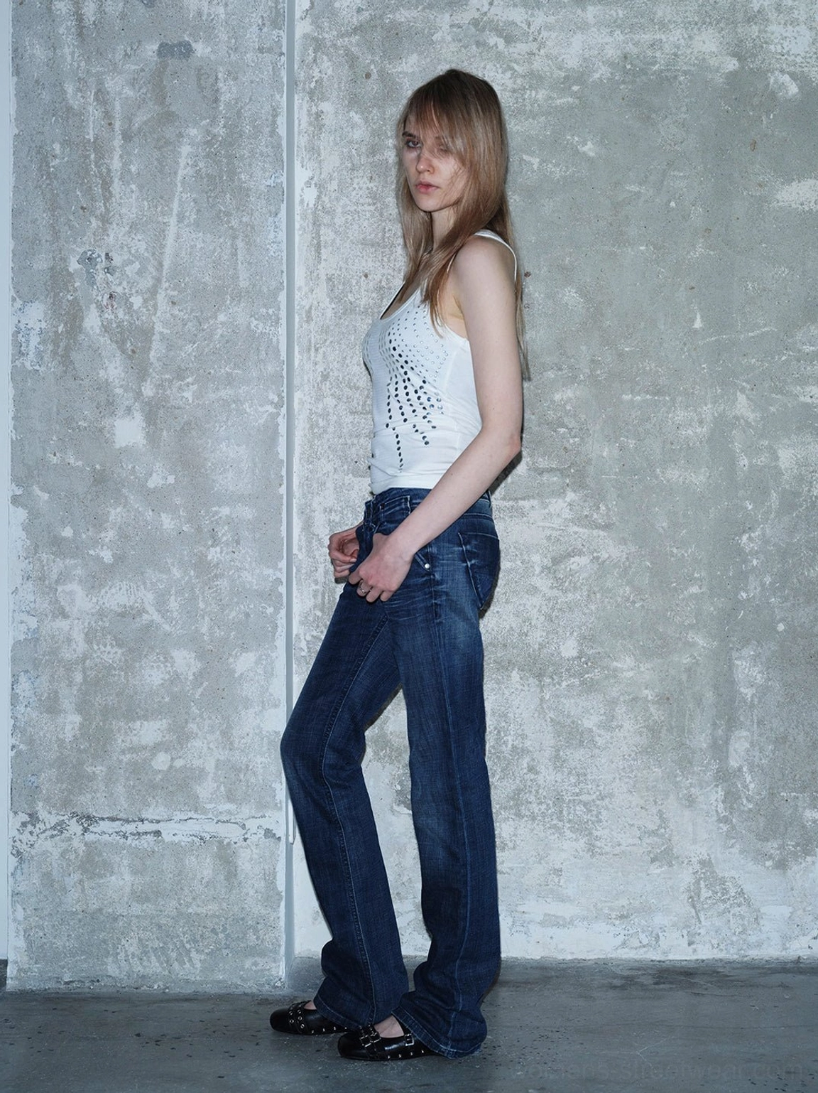 Black studded platform Mary Jane flats in a relaxed Y2K streetwear outfit with jeans and fitted tank top