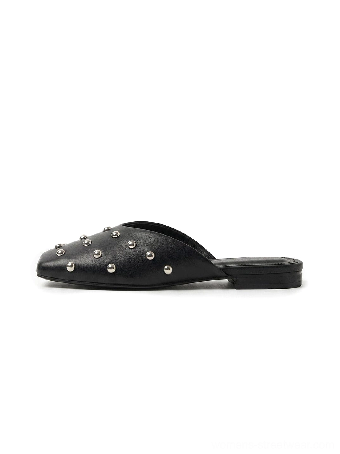 Black studded pointed-toe mule flat with silver-tone round rivets, smooth upper, and open-back slip-on silhouette shown from the side